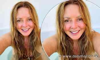 Carol Vorderman, 60, shows off her ample assets in a busty nude。